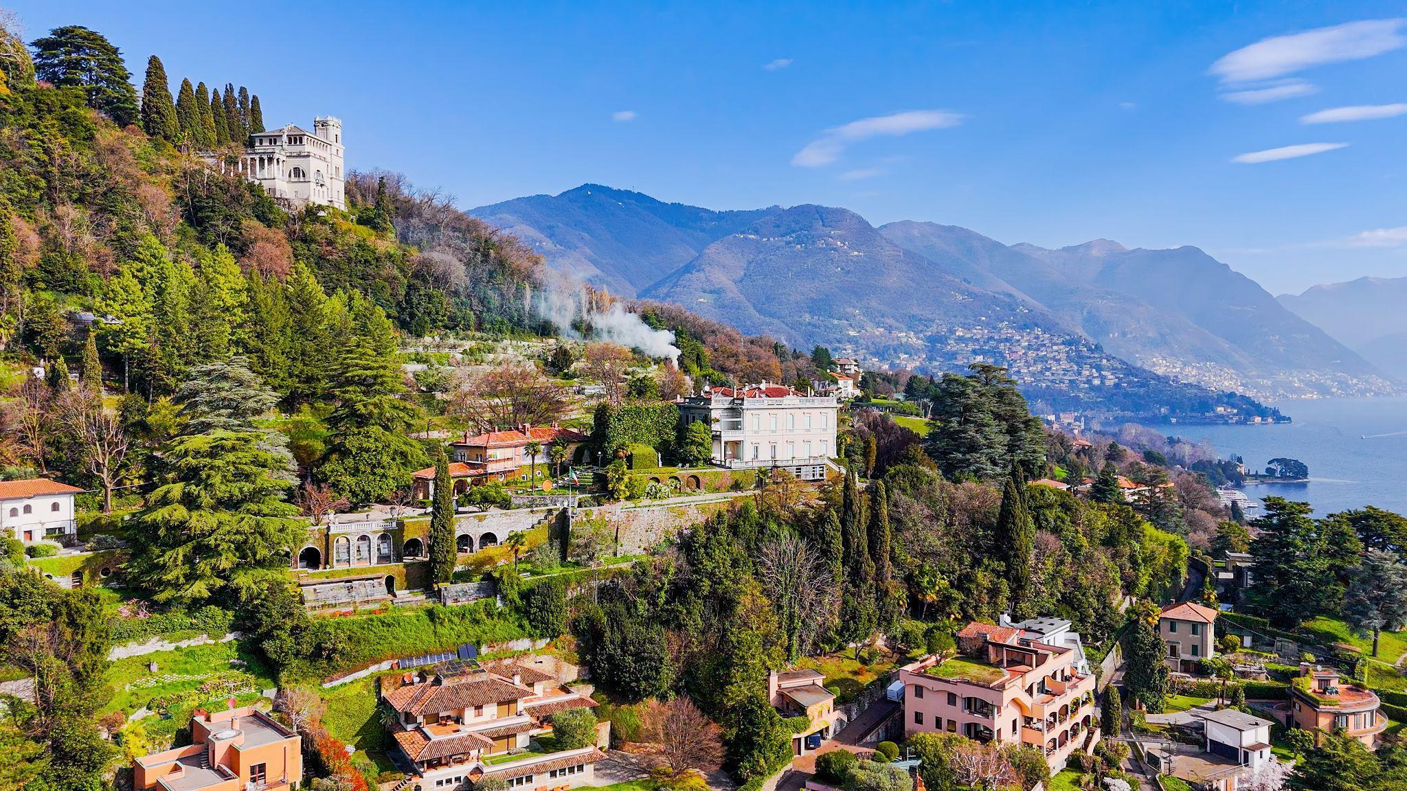 Aerial panoramic view of luxury villas and lush greenery on the hills overlooking Lake Como in Northern Italy, Elegant architecture and natural landscape in a tranquil lakeside setting, European travel and lifestyle concept
