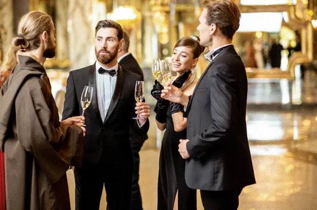 Close protection officer discreetly monitoring guests at a formal private event, illustrating how professional security supports personal safety without disrupting the client experience.